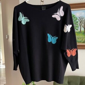 Elegant Black Sweater with Colorful Butterfly Details